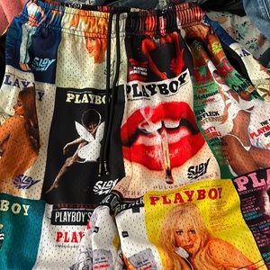 playboy collage shorts. zipper pockets. size large.